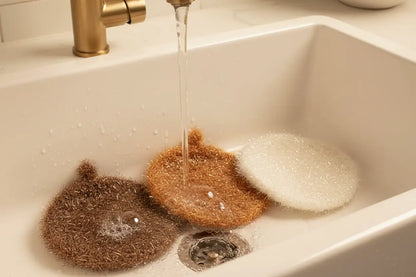 Trio of brown Mocha CollectionHello Scrubbies being rinsed under running water in a sink.